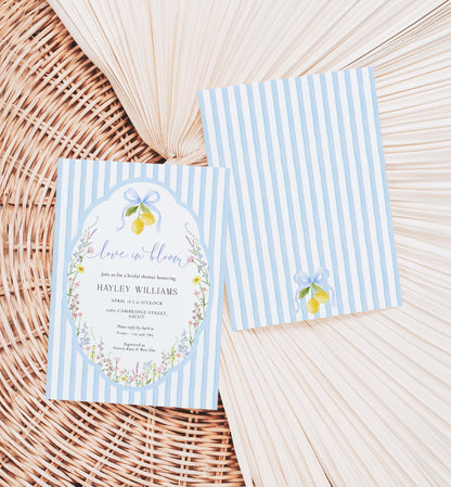Two blue striped invitations with floral designs on a woven surface. Printable Love In Bloom Shower Invitation Template, Something Blue Bridal Shower Invite, Spring Wildflower Bridal Brunch Evite, Posey