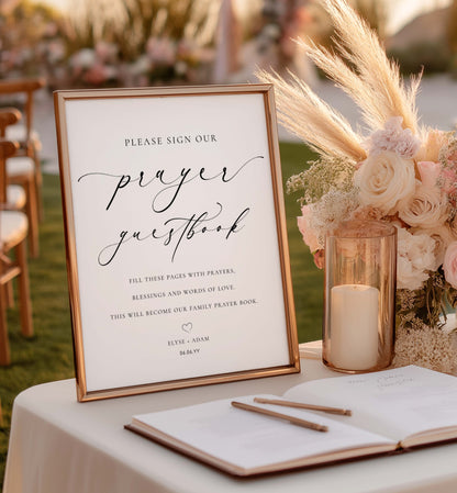 Wedding prayer guestbook with floral arrangement and candle on a table outdoors. Minimalist Wedding Prayer Guestbook Sign (Printable), Bible Guestbook