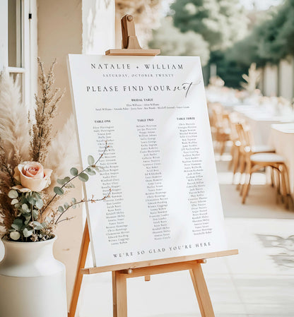 Wedding seating chart on an easel with floral decorations in an outdoor setting. Printable Wedding Table Plan Template, Minimalist Wedding Banquet Long Tables Seating Chart Template, Wedding Seating Plan Poster, Ellesmere
