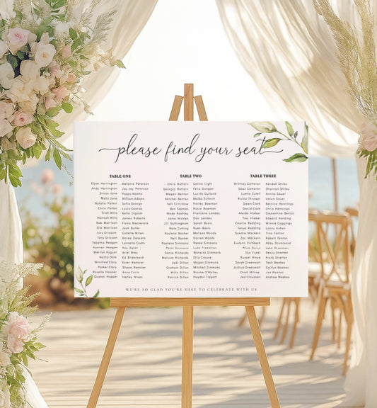 Seating chart on an easel with floral decorations at a wedding venue. Printable Wedding Table Plan, Banquet Long Tables Seating Chart, Editable Seating Chart Template, Darcy Greenery Wedding Seating Plan Poster