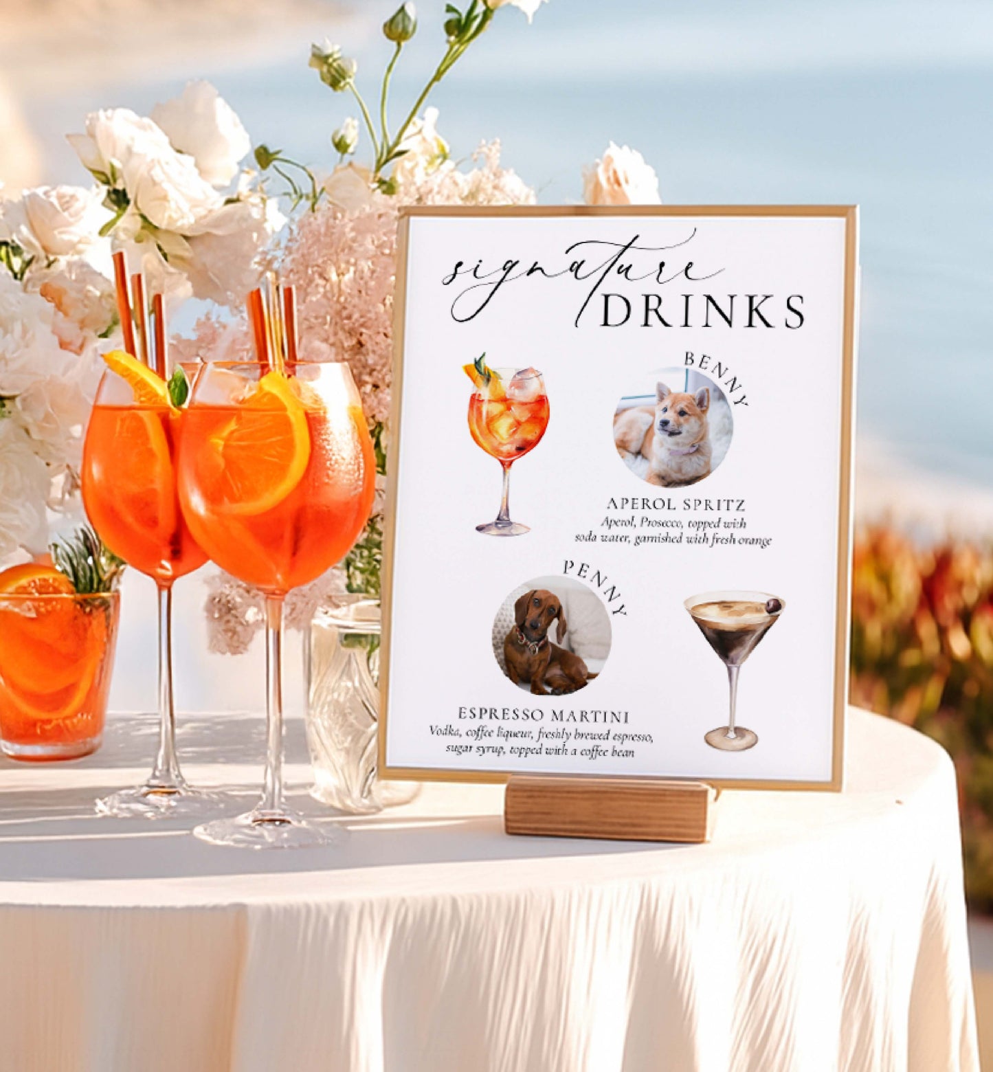 Signature drinks sign with cocktail illustrations and a table with orange cocktails.