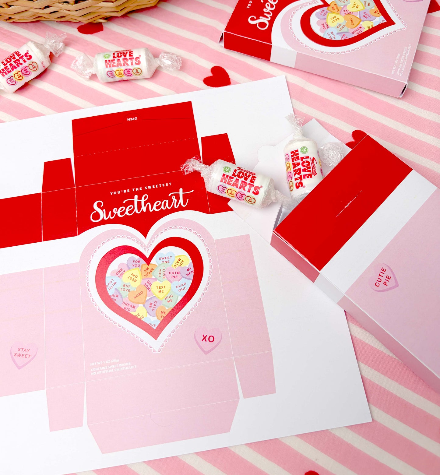 Valentine's Day-themed packaging with heart designs and candy on a pink and white striped background. Sweetheart Candy Valentine's Day Favor Box (DIY Printable Download)