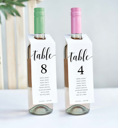 Two wine bottles with table number labels on a white background. Printable Table Number Wine Bottle Tags, Minimalist Wedding Table Numbers, Table Seating Plan Cards, Table Numbers with Guest Names, Leyton