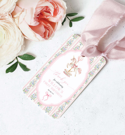Pink baby shower invitation with floral design and ribbon on a white surface with flowers. Carousel Horse Thank You Printable Favor Tag, Girl First Birthday, Whimsical Pink Vintage Circus Horse