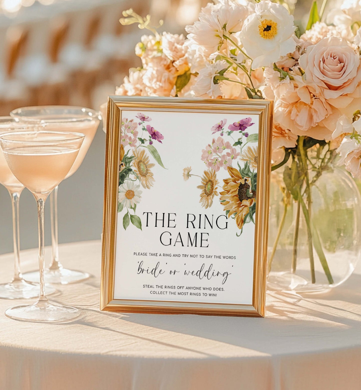 Decorative sign for a ring game at a wedding reception with floral arrangements and cocktails. The Ring Game Sign, Printable Don't Say Bride or Wedding Game Sign, Autumn Fall Sunflower Bridal Shower Game Sign, Mews