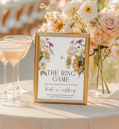 Decorative sign for a ring game at a wedding reception with floral arrangements and cocktails. The Ring Game Sign, Printable Don't Say Bride or Wedding Game Sign, Autumn Fall Sunflower Bridal Shower Game Sign, Mews