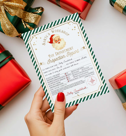 Hand holding a 'Toy Department Inspection Report' from Santa's Workshop with Christmas-themed. Printable Santa’s Workshop Toy Inspection Report, Christmas Gift Tag, From Santa Tag, Kid's Christmas Gift, Made In The North Pole, Stripe decorations.