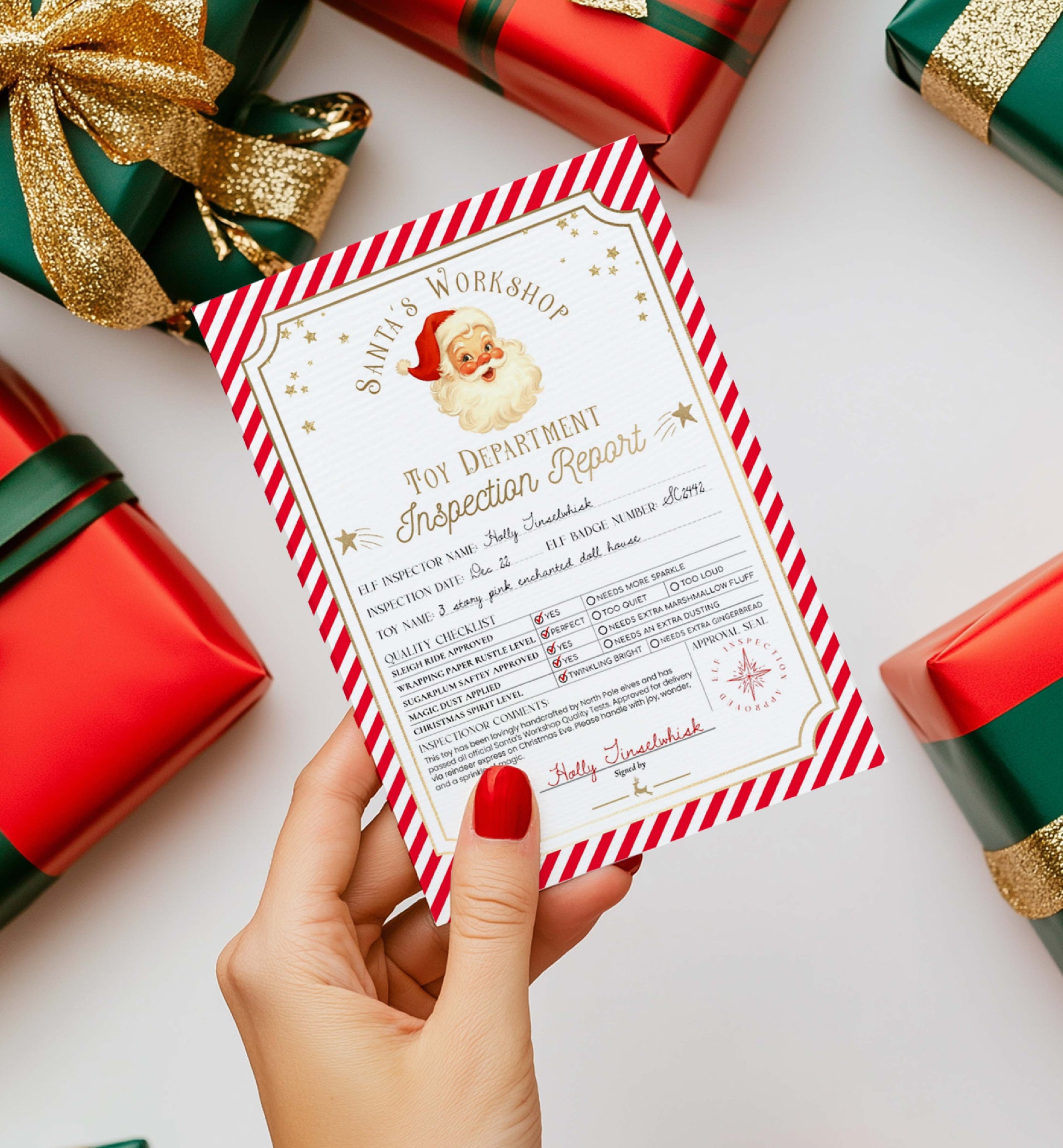 Hand holding a Christmas-themed inspection report card with wrapped gifts in the background. Printable Santa’s Workshop Toy Inspection Report, Christmas Gift Tag, From Santa Tag, Kid's Christmas Gift, Made In The North Pole, Stripe