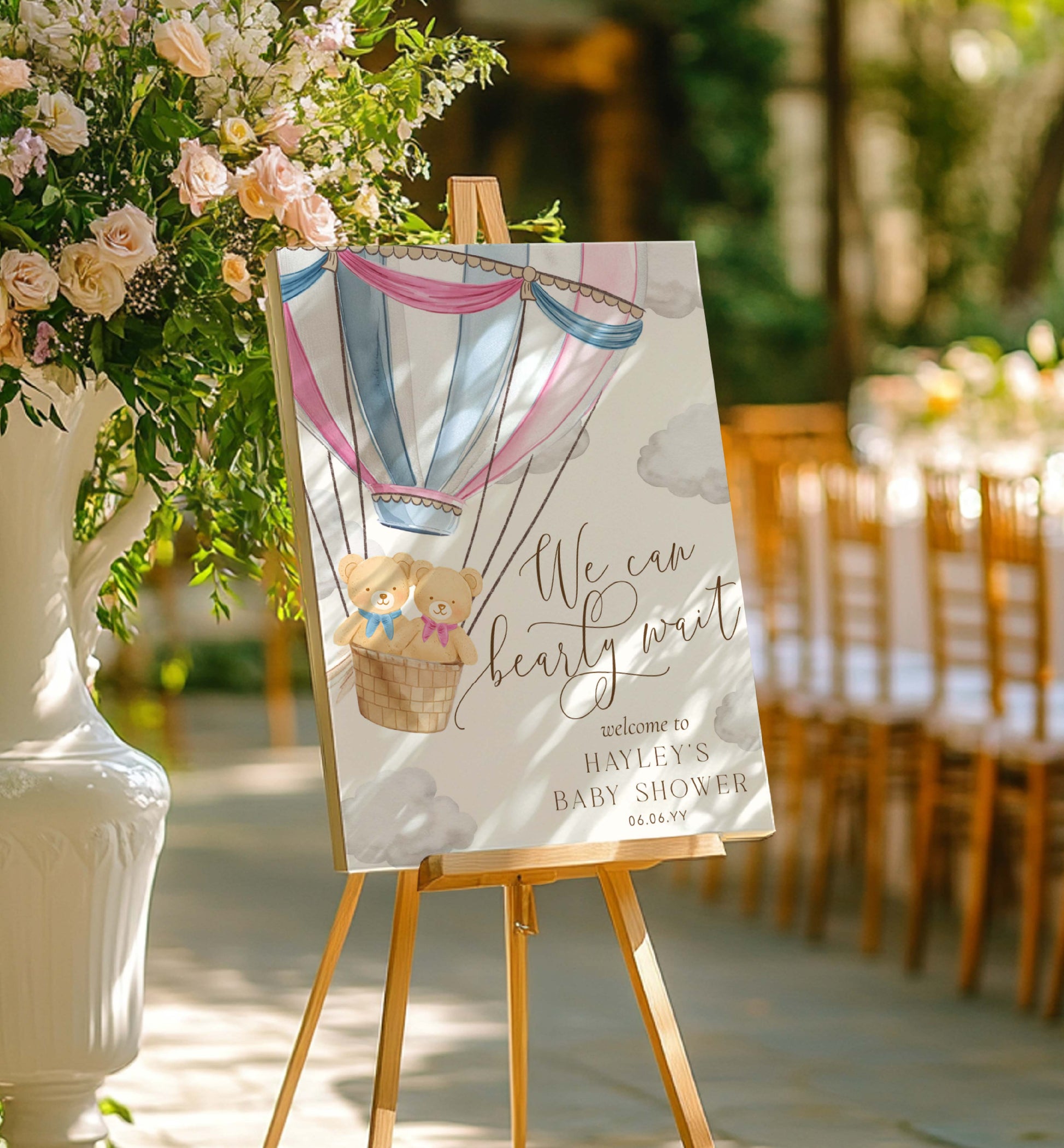 Baby shower welcome sign with hot air balloon and teddy bear design, placed outdoors. Printable We Can Bearly Wait Hot Air Balloon Boy and Girl Twins Teddy Bear Welcome Sign Template
