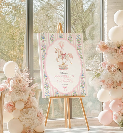 Decorative sign on an easel with floral and balloon design, surrounded by balloons and flowers in a bright room. Carousel Horse Welcome Sign, Printable First Birthday Welcome Sign, Girl First Birthday, Whimsical Pink Vintage Circus Unicorn Horse