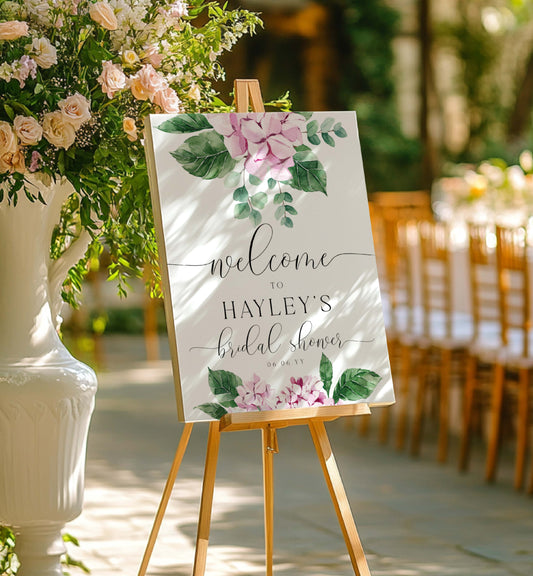 Welcome sign for Hayley's bridal shower with floral design on an easel outdoors. Printable Welcome Template, Pink Hydrangea Bridal Shower Welcome Sign, Girl Baby Shower Welcome Sign, Wedding Welcome Sign, Ferras Blossom