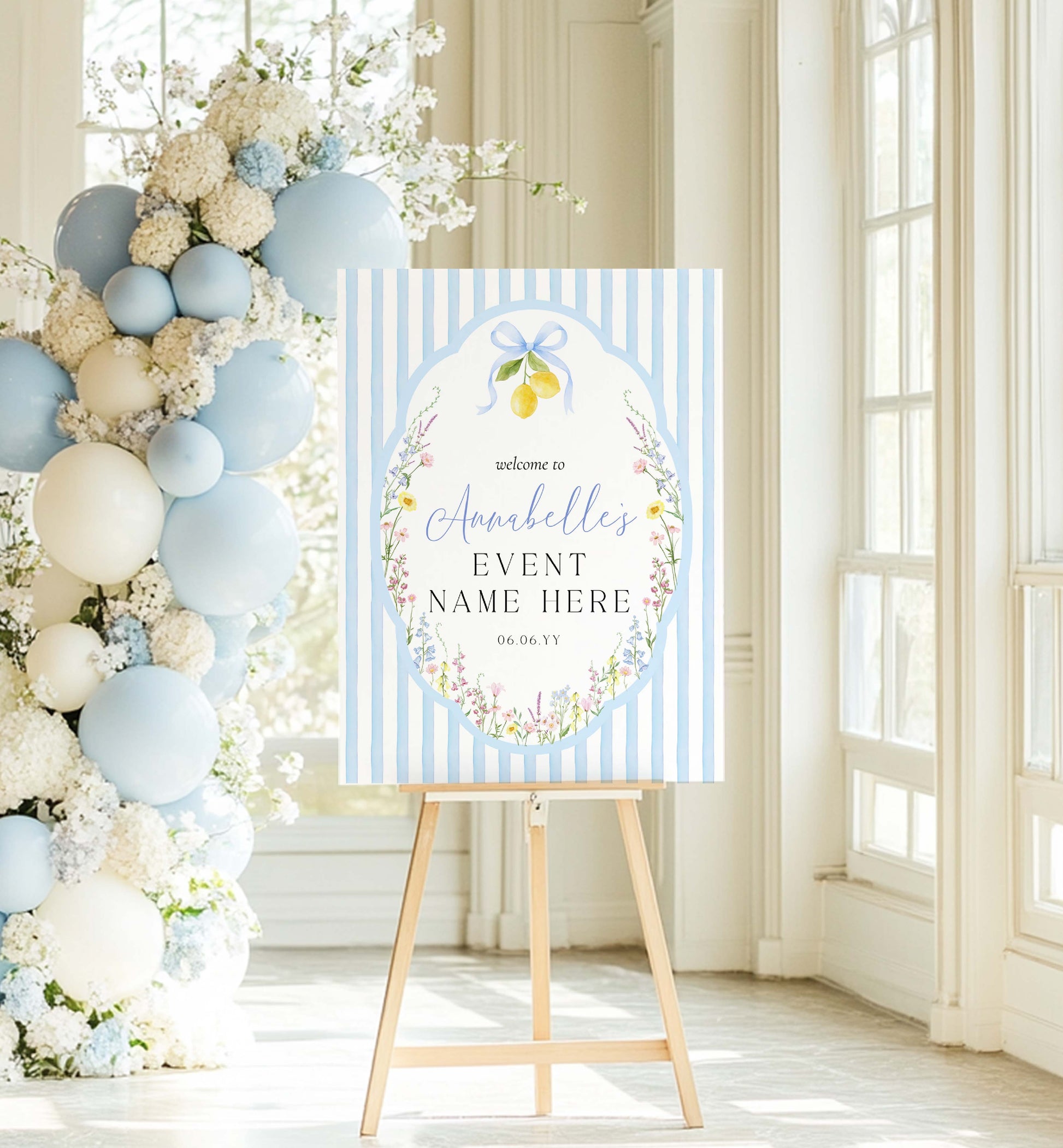 Decorative sign on a stand with floral and balloon arch in a bright room. Printable Bridal Shower Welcome Sign, Spring Wildflower, Blue Bow Ribbon, Bachelorette Party, Hens Party, Baby Shower Welcome Sign, Baby In Bloom