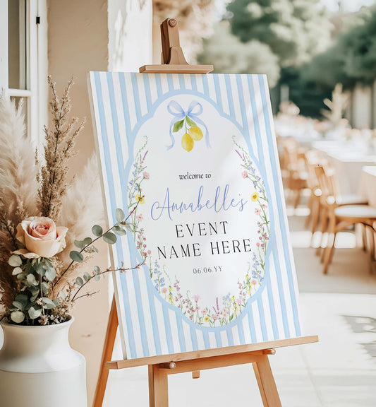 Decorative sign on an easel with floral and lemon design, set outdoors. Printable Bridal Shower Welcome Sign, Spring Wildflower, Blue Bow Ribbon, Bachelorette Party, Hens Party, Baby Shower Welcome Sign, Baby In Bloom