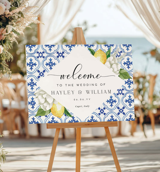 Wedding welcome sign with floral and lemon design on an easel outdoors. Mediterranean Blue Tile Lemons Wedding Welcome Sign Template, Printable Capri Lemons Wedding Sign, Bridal Shower Welcome Sign, The Med